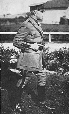 Capt Albert B More carrying a revolver while running